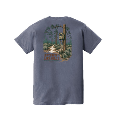 Pine Woods Watch Lowcountry Backroads youth T-shirt graphic featuring a camouflaged tree stand, pine forest, palmettos and woodland trail