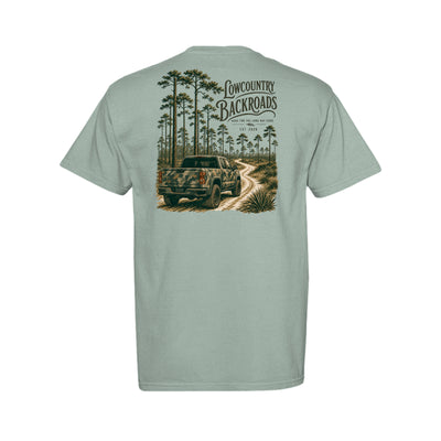 The Long Way Home Southern graphic featuring a camouflage pickup on a winding dirt road through a tall pine forest.