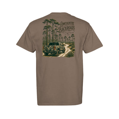 The Long Way Home Southern graphic featuring a camouflage pickup on a winding dirt road through a tall pine forest.
