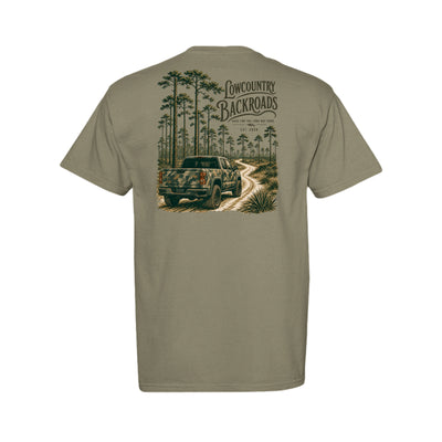 The Long Way Home Southern graphic featuring a camouflage pickup on a winding dirt road through a tall pine forest.