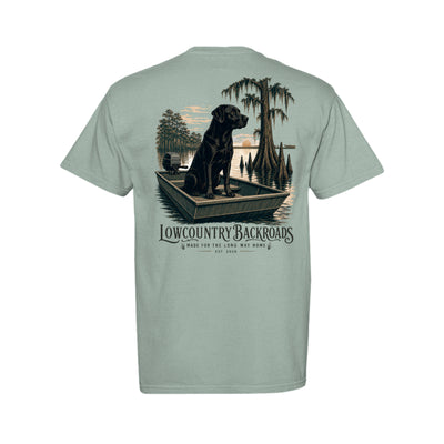 Steady at First Light graphic with a black Labrador sitting in a jon boat among moss-draped cypress trees at sunrise.