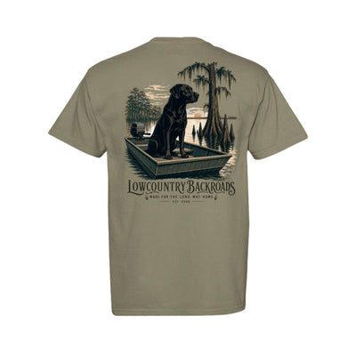 Steady at First Light graphic with a black Labrador sitting in a jon boat among moss-draped cypress trees at sunrise.